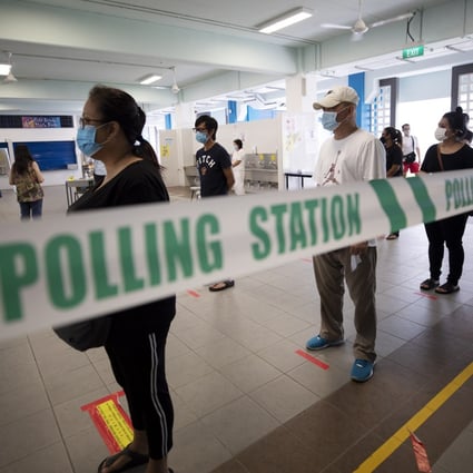 Voters queue to cast their ballots at a polling station in Singapore on July 10, 2020. Photo: EPA-EFE