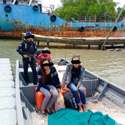 A handout photo made available by Johor police showing people smugglers and immigrants in a boat shortly before their arrest. Photo: Handout / Johor police