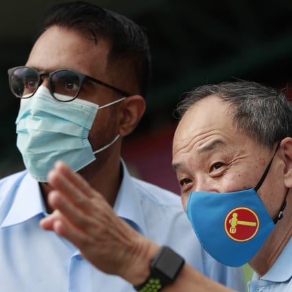 Singapore Workers’ Party chief Pritam Singh (left) and former chief Low Thia Khiang at a campaign walkabout on Wednesday. Photo: EPA-EFE