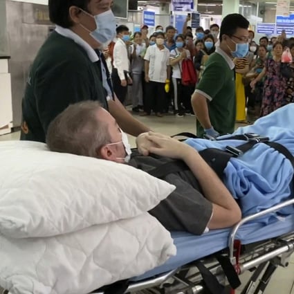 Stephen Cameron is wheeled out of the hospital to the airport to leave Vietnam on July 11, 2020. Photo: EPA-EFE