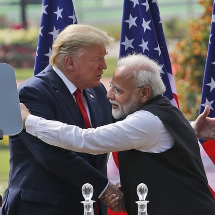 US President Donald Trump and Indian Prime Minister Narendra Modi embrace after giving a joint statement in New Delhi on February 25. Photo: AP
