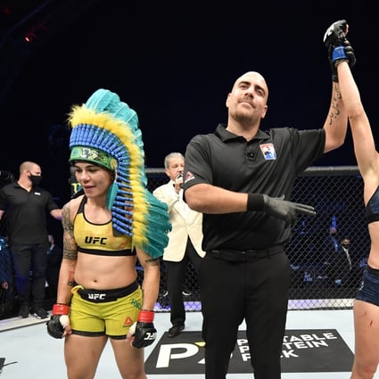 Rose Namajunas celebrates after her split-decision victory over Jessica Andrade in their strawweight fight during UFC 251. Photos: USA TODAY Sports