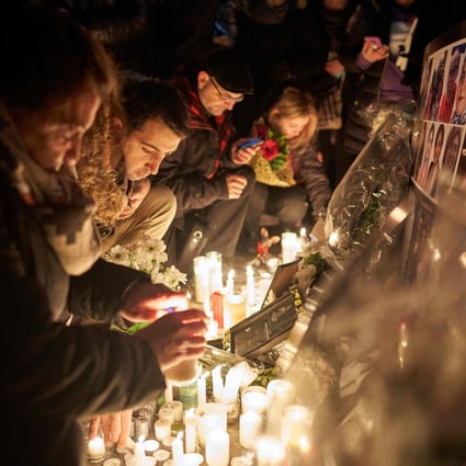 Mourners light candles for the victims of Ukrainian Airlines flight 752 during a vigil at Mel Lastman Square in Toronto, Canada, in January – 55 Canadian citizens were among the dead. Photo: AFP