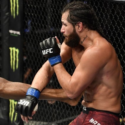 Kamaru Usman kicks Jorge Masvidal in their UFC welterweight championship fight during UFC 251. Photos: Jeff Bottari/Zuffa LLC