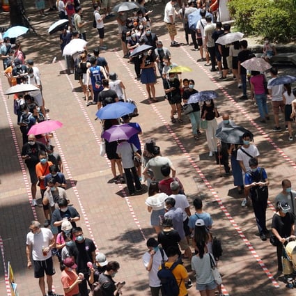 People queue up in Hong Kong’s Tai Po area on Sunday to vote in an opposition camp primary, as similar scenes unfolded across the city. Photo: Felix Wong