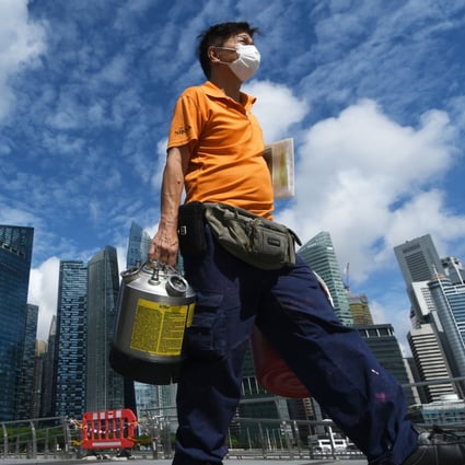A worker delivers goods in Singapore. Photo: Xinhua