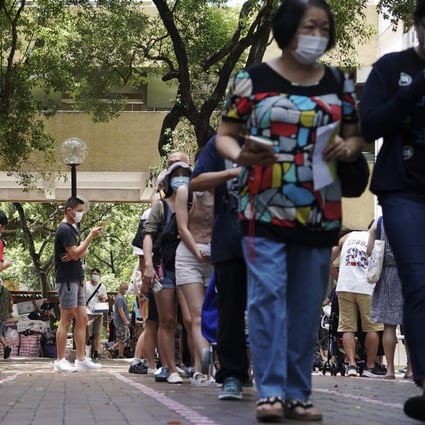 Lengthy queues form at a polling station in Tai Po on Sunday. Photo: Felix Wong