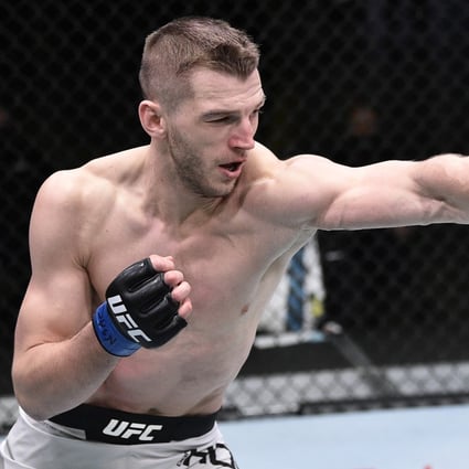 Dan Hooker punches Dustin Poirier during their UFC Fight Night bout. Photo: Chris Unger/Zuffa LLC via USA TODAY Sports