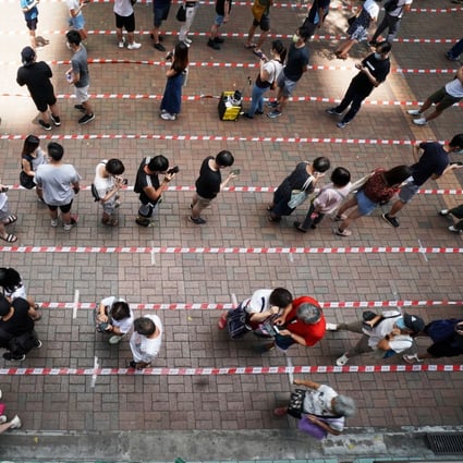 People line up in Tai Po to vote in the Hong Kong primary election. Photo: Felix Wong