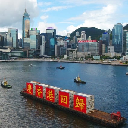 A barge bearing the slogan of “Celebrating the 23rd anniversary of Hong Kong’s return to the motherland” sails through Victoria Harbour in Hong Kong on July 1. Photo: Xinhua