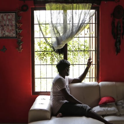 Prasad Dinesh sits in his house in Ja-Ela, Sri Lanka. Photo: AP