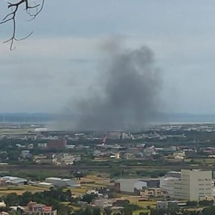 Smoke rises from the scene of the fatal crash at an air force base in Hsingchu. Photo: Facebook