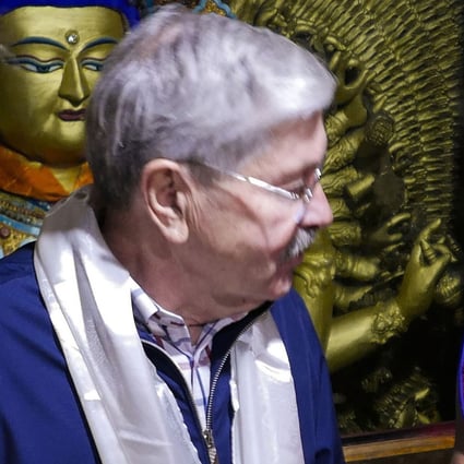 US Ambassador to China Terry Branstad speaks with a monk at the Jokhang Temple in Lhasa in the Tibet Autonomous Region in May 2019. Photo: US Mission to China via AP