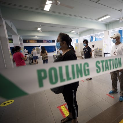 Voters queue to cast their ballots at a polling station in Singapore on July 10. Singaporeans continued the ruling People’s Action Party’s hold on power since independence but also elected a record number of opposition members to parliament as a ‘check and balance’ on the government. Photo: EPA