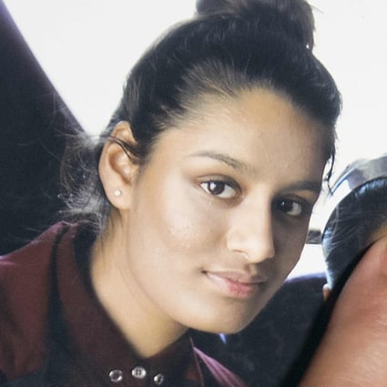 A photo of Shamima Begum is held by her sister during an interview in London in February 2015. Photo: AFP