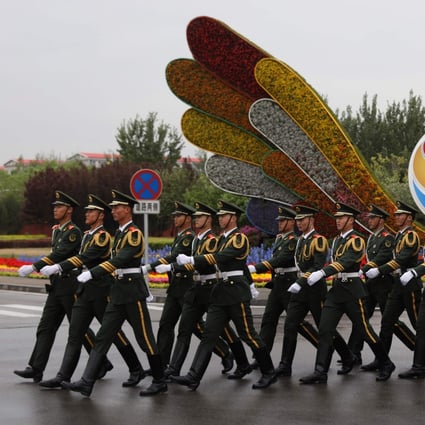 Chinese paramilitary police march outside the second Belt and Road Forum in Beijing last year. Photo: AFP
