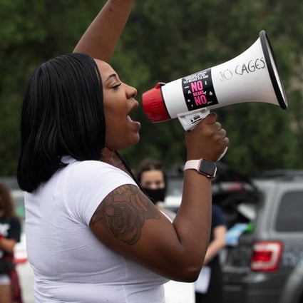 Educator Victoria Clark protests outside the Oakland County Circuit Court and Prosecutors Office in Pontiac, Michigan, on Thursday. Photo: Reuters