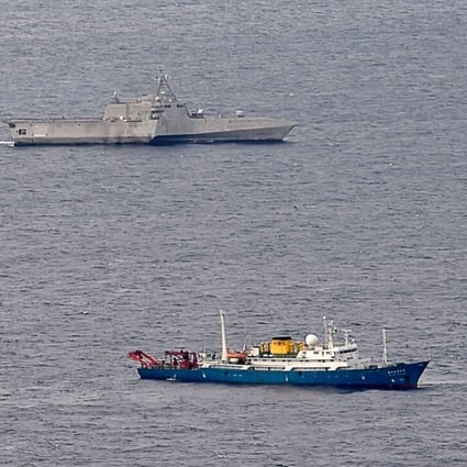 The USS Gabrielle Giffords (top) conducts operations near a Chinese survey vessel in the South China Sea on July 1. Washington has hardened its position on the South China Sea and rejected most of Beijing’s claims to the resource-rich waterway. Photo: US Navy