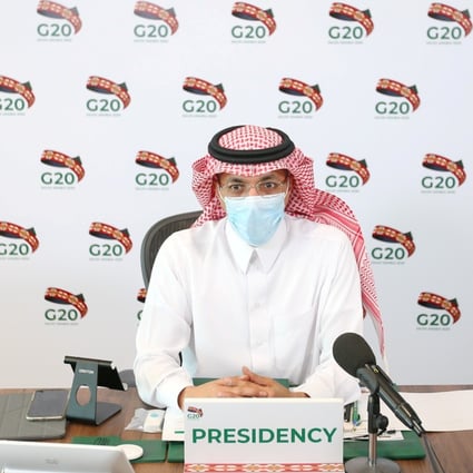 Saudi Minister of Finance Mohammed al-Jadaan wears a protective mask as he attends a virtual meeting of G20 finance ministers and central bank governors. Photo: Handout via Reuters