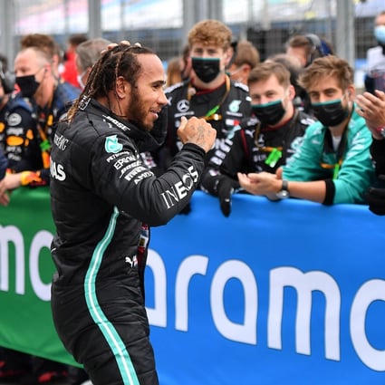 Britain’s Lewis Hamilton, of Mercedes, celebrates winning the Hungarian Grand Prix with his team at the Hungaroring track. Photo: Reuters