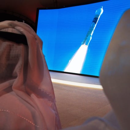 Emirati men watch the launch of the “Amal” or “Hope” space probe at the Mohammed bin Rashid Space Centre in Dubai. Photo: AP Photo