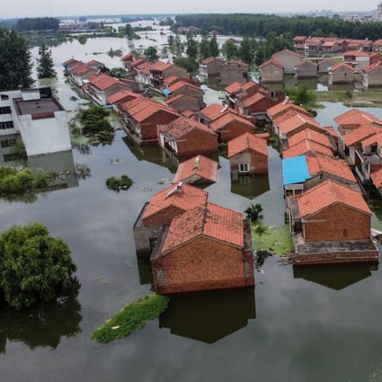 Homes flooded as water levels of the Yangtze River keep rising in Jiujiang, Jiangxi province, on July 18. Vast swathes of China have been inundated by the worst flooding in decades along the Yangtze, with residents piling into boats and makeshift rafts to escape a deluge that has collapsed flood defences and turned homes into waterways. Photo: AFP