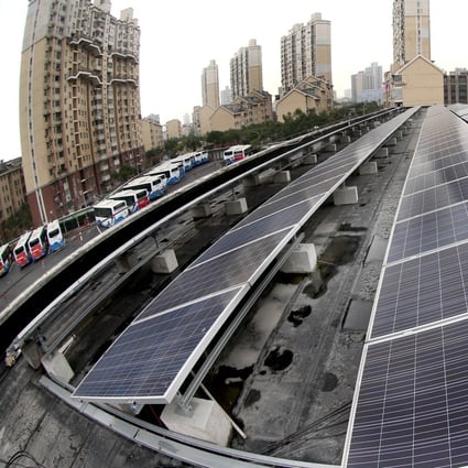 Solar panels at a solar-powered bus station in Shanghai in December 2016. China has more renewable energy capacity than any other country in the world. Photo: Xinhua