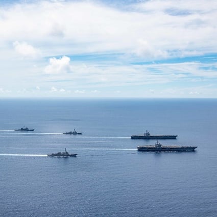 In this file photo, the Ronald Reagan and Nimitz Carrier Strike Groups steam in formation in the South China Sea, July 6. (U.S. Navy/MC3 Jason Tarleton)