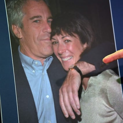 A US attorney points to a photo of Ghislaine Maxwell and Jeffrey Epstein while announcing charges against Maxwell last July. Photo: AFP