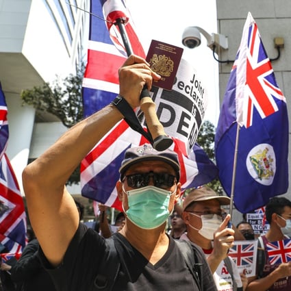 A protester holds up a BN(O) passport during a rally in Hong Kong in October. The British home secretary said BN(O) citizens in the city were “in a unique position”. Photo: Nora Tam