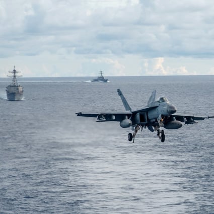 An F/A-18E Super Hornet approaches one of the two American aircraft carriers that have been conducting exercises in the South China Sea. Photo: EPA