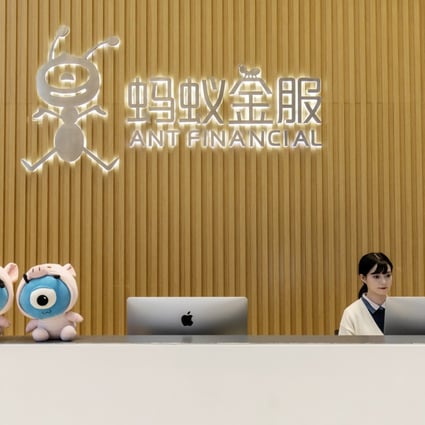 An employee works at a reception counter in the lobby of the Ant Financial headquarters in Hangzhou, China, Oct. 17, 2019. Photo: Bloomberg