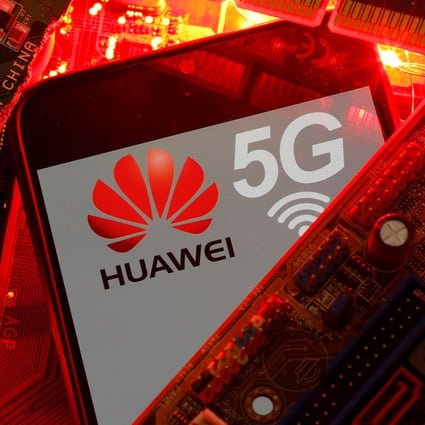 A smartphone with the Huawei and 5G network logo is seen on a PC motherboard in this illustration picture taken January 29, 2020. Photo: Reuters