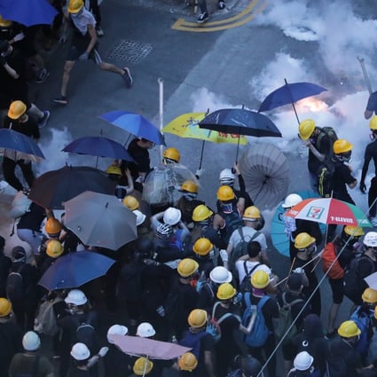 Riot police fire tear gas at protesters on Des Voeux Road West on July 28, 2019. Photo: Edmond So