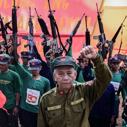 Jaime Padilla, a spokesman for the CPP-NPA, with his comrades in March 2019 at the 50th anniversary of the movement taking up arms in the Philippines. Photo: EPA