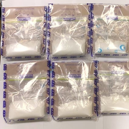 Officers seized about 3kg of suspected ketamine from a hotel room in Sham Shui Po. Photo: Handout