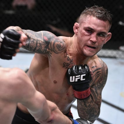 Dustin Poirier punches Dan Hooker during UFC Fight Night at the UFC APEX. Photo: Chris Unger/Zuffa LLC via USA TODAY Sports