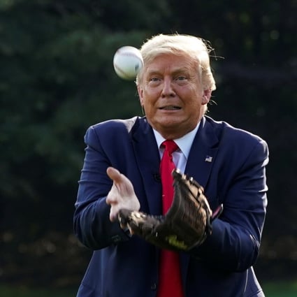 US President Donald Trump catches a ball while hosting young baseball players at the White House. Photo: Reuters