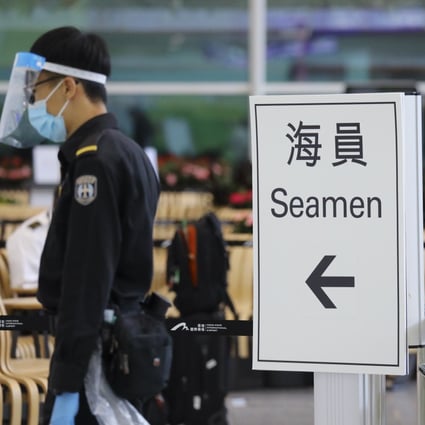A sign directs incoming seamen at Hong Kong International Airport’s arrivals hall to Covid-19 testing at the nearby AsiaWorld-Expo. Dickson Lee