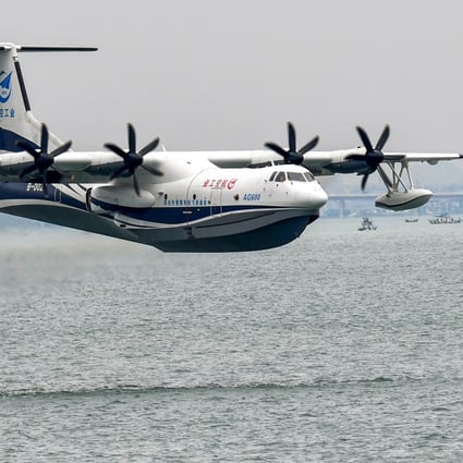 An AG600 Kunlong amphibious aircraft flies over the sea off Qingdao, in Shandong province, on Sunday. The aircraft took off from the sea off Qingdao at 10.18am and completed the test flight after flying for about 31 minutes, the Aviation Industry Corporation of China said. Photo: Xinhua
