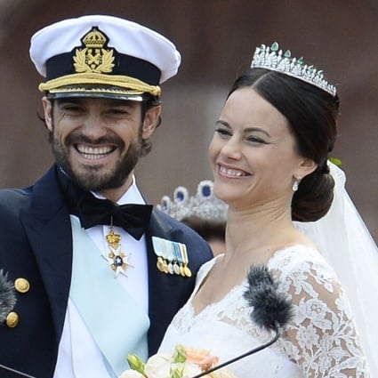 Sweden's Princess Sofia and Prince Carl Philip greet the crowds after their wedding ceremony at Stockholm Palace. Photo: AFP