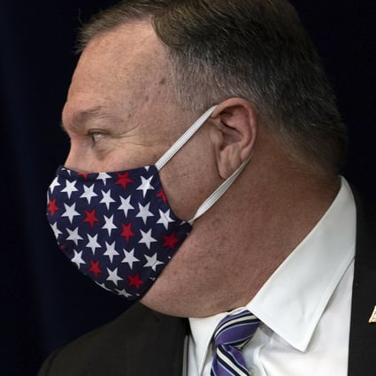 Secretary of State Mike Pompeo wears a face mask as he leaves after a news conference at the State Department in Washington on Tuesday. Photo: AP