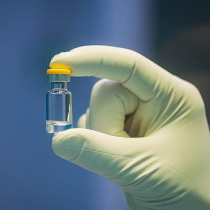 A researcher holds an individual dose of a coronavirus vaccine. The World Health Organisation says about 160 vaccines are in development, including India’s Covaxin. Photo: Reuters