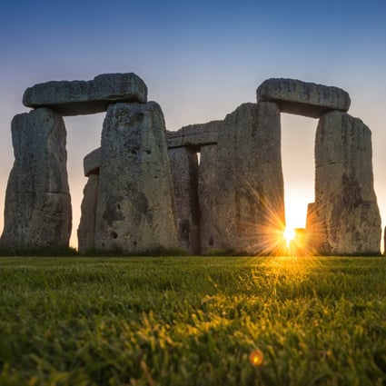 The Stonehenge stone circle during the sunset, near Amesbury, Britain. Photo: English Heritage/A. Pattenden handout via Reuters