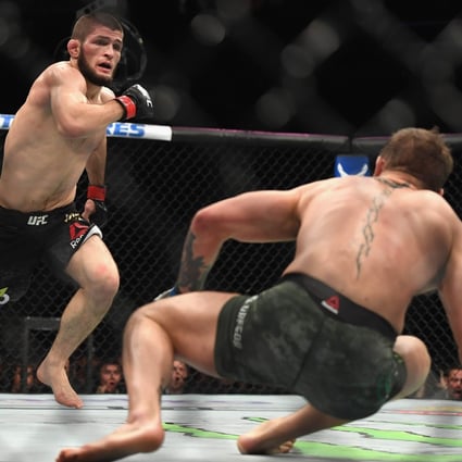 Khabib Nurmagomedov chases down Conor McGregor in their lightweight championship bout during UFC 229. Photo: AFP