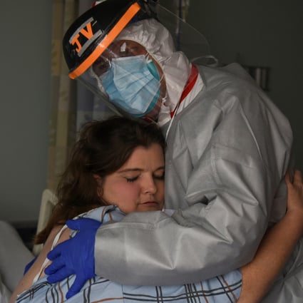 Chief medical officer Joseph Varon hugs Christina Mathers, a nurse from his team who became infected with Covid-19, at United Memorial Medical Centre in Houston, Texas, on Saturday. Photo: Reuters