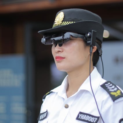 A security staff member at Liangzhu Museum in Hangzhou, eastern China, wears a pair of Rokid smart glasses to check the temperature of visitors. Photo: Handout