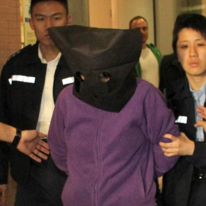 Police officers arrest Kan Kwai-fong. Photo: Handout