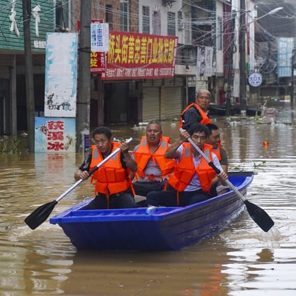 Many Dixi residents had to rely on friends and neighbours with boats to rescue them from their flooded homes. Jiangxi. Photo: Tom Wang