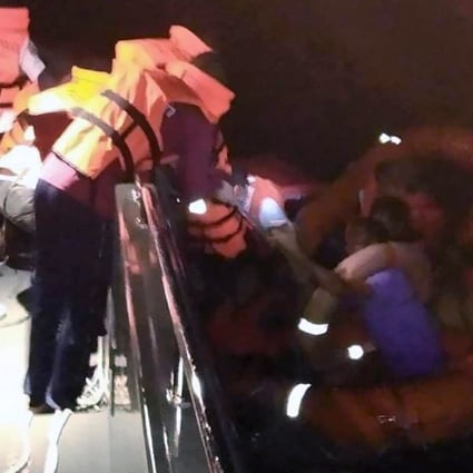 Rescue officials help survivors after a ferry capsized amid stormy weather off the coast of Koh Samui island, Surat Thani province, Thailand. At least nine people were rescued. Photo: EPA-EFE